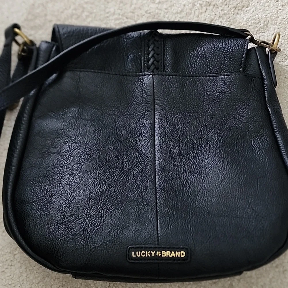 Lucky Brand black leather purse with magnetic tassle closure. It is 10"x10". - Picture 6 of 7